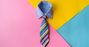https://www.vecteezy.com/photo/46455016-a-blue-striped-tie-against-a-pink-blue-and-yellow-background
