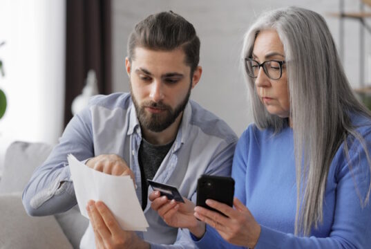 https://www.freepik.com/premium-photo/young-man-helping-aged-mother-paying-bills-online-with-credit-card-making-purchase-online-store_19246224.htm#fromView=search&page=1&position=10&uuid=215a1968-da8e-420a-a384-e1c5315a28eb