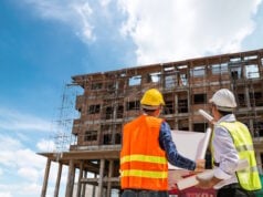 https://www.vecteezy.com/photo/2439960-businessman-and-engineer-looking-at-a-building-blueprint-at-a-high-rise-building-construction-site