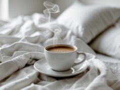 https://www.vecteezy.com/photo/54394749-there-is-a-cup-of-coffee-on-a-saucer-on-a-bed
