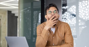 https://www.vecteezy.com/photo/46849957-tired-businessman-yawning-at-his-desk-surrounded-by-a-laptop-and-crumpled-papers-in-a-modern-office-setting-concept-of-fatigue-overworked-and-stress