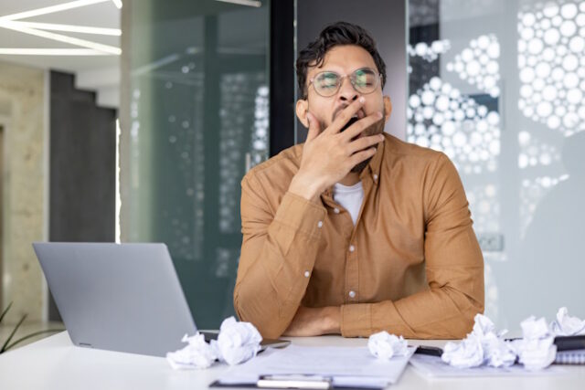 https://www.vecteezy.com/photo/46849957-tired-businessman-yawning-at-his-desk-surrounded-by-a-laptop-and-crumpled-papers-in-a-modern-office-setting-concept-of-fatigue-overworked-and-stress