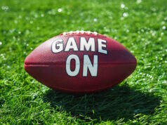 https://www.vecteezy.com/photo/40142753-ai-generated-generative-ai-american-football-ball-on-the-green-game-field-with-words-game-on