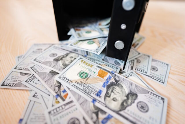 Open safe door against dollar money. https://www.vecteezy.com/photo/22209516-open-safe-door-against-dollar-money