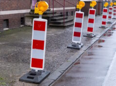 https://www.vecteezy.com/photo/54709518-red-and-white-traffic-barriers-marking-road-construction-zone-on-a-rainy-day