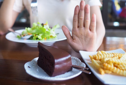 https://www.vecteezy.com/photo/20808730-the-hands-of-women-care-for-health-and-diet-pushed-from-the-chocolate-cake-and-french-fries-plate-and-choose-eat-vegetable-or-salad-that-contains-vitamins-and-helps-control-weight-for-a-slim-stock