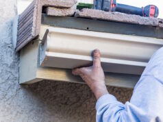 https://www.vecteezy.com/photo/16446164-worker-attaching-aluminum-rain-gutter-to-fascia-of-house