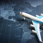 Passenger plane on the world map.Business transportation system concept