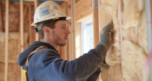 https://www.vecteezy.com/photo/44651843-a-technician-demonstrating-the-proper-technique-for-installing-batt-insulation-between-wall-studs-ensuring-a-snug-efficient-fit