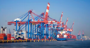 https://www.vecteezy.com/photo/41002122-ai-generated-a-ship-for-transporting-cargo-containers-and-also-unloading-it-at-the-docks-of-a-cargo-port-ai-generated
