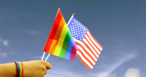 https://www.vecteezy.com/photo/51170590-cut-out-of-hand-holding-both-the-lgbt-flag-and-the-american-flag-set-against-blue-sky-background-with-clipping-paths-the-symbolizing-unity-diversity-and-inclusion