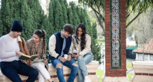 https://www.vecteezy.com/photo/54492456-group-of-four-college-friends-relaxing-with-book-and-smartphone