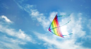 https://www.vecteezy.com/photo/6863698-rainbow-kite-flying-in-blue-sky-with-cloud