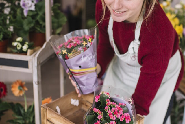 content-woman-arranging-delivered-flowers https://www.freepik.com/free-photo/content-woman-arranging-delivered-flowers_1778123.htm#fromView=search&page=1&position=10&uuid=42375627-a8d5-4e36-b39a-544f70a0d94a&query=floral+shop
