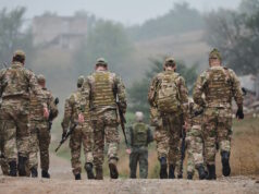 https://www.vecteezy.com/photo/50418029-a-disciplined-and-specialized-military-unit-donned-in-camouflage-strategically-patrolling-and-maintaining-control-in-a-high-stakes-environment-showcasing-their-precision-unity-and-readiness-for