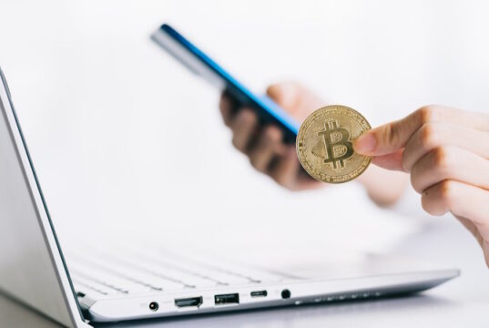 https://www.vecteezy.com/photo/2875476-asian-woman-holding-coin-in-hand-while-using-laptop-and-smartphone