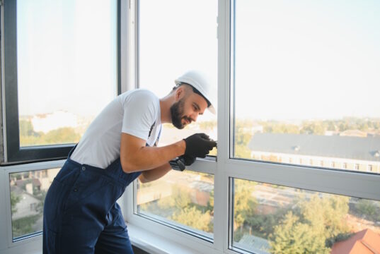 https://www.vecteezy.com/photo/54578678-construction-worker-repairing-plastic-window-with-screwdriver-indoors-space-for-text