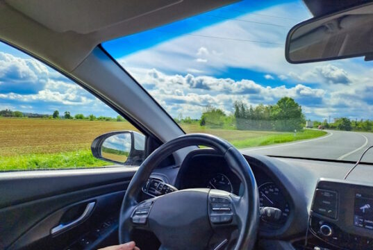 https://www.vecteezy.com/photo/47120378-man-hands-holding-car-steering-wheel-while-driving-through-countryside-landscape