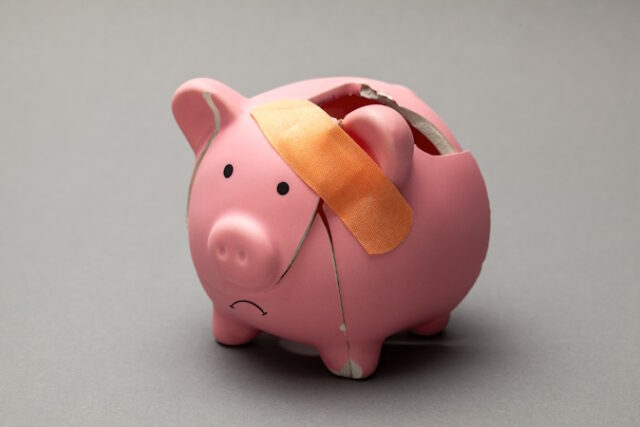 Broken piggy bank with band-aid on gray background. https://www.freepik.com/premium-photo/broken-piggy-bank-with-band-aid-gray-background_18143648.htm#from_element=detail_alsolike