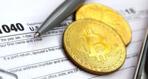https://www.vecteezy.com/photo/12297226-the-pen-bitcoins-and-dollar-bills-is-lies-on-the-tax-form-1040-u-s-individual-income-tax-return-the-time-to-pay-taxes