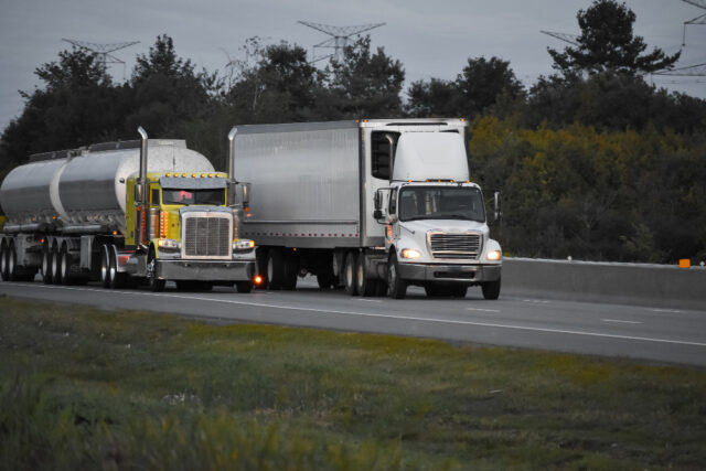 https://www.freepik.com/free-photo/trailer-trucks-driving-road-surrounded-by-beautiful-green-trees_9932046.htm#fromView=search&page=1&position=7&uuid=d9b6848d-ed89-4429-956e-dabbff2af5f9&query=semi+truck