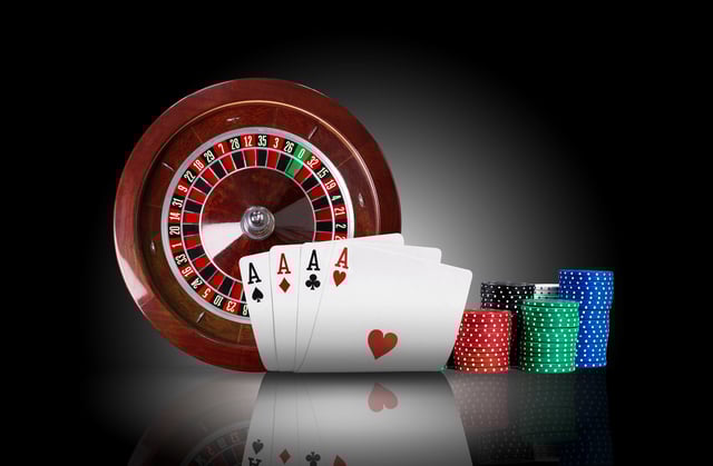 casino https://www.vecteezy.com/photo/34929729-four-aces-standing-on-mirror-surface-with-backlight-ahead-of-brown-roulette-and-chips-in-piles-black-background-gambling-entertainment-close-up