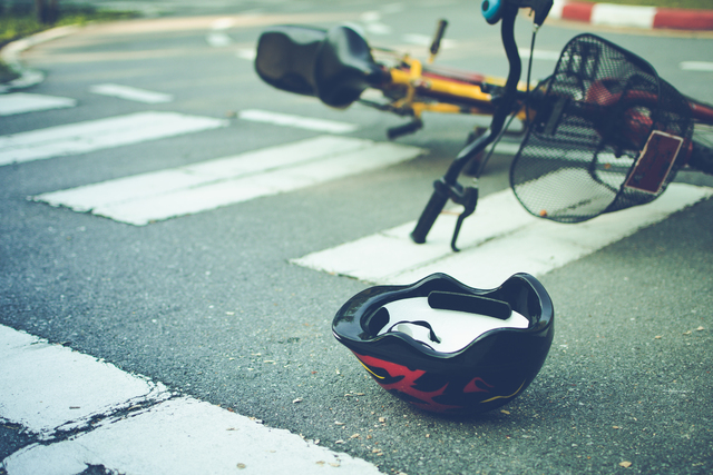 https://www.vecteezy.com/photo/7183138-helmet-and-bike-lying-on-the-road-on-a-pedestrian-crossing-after-accident
