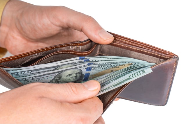 Man hands holding a wallet with dollars, counting money https://www.vecteezy.com/photo/42372474-man-hands-holding-a-wallet-with-dollars-counting-money