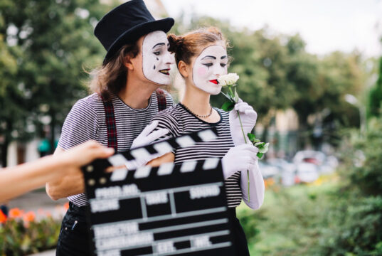 https://www.freepik.com/free-photo/close-up-hand-holding-clapperboard-front-mime-couple_2955177.htm#fromView=search&page=1&position=38&uuid=de6d0d55-f871-4cb7-a2ba-bdc1efbeb7c4&query=movie+actors