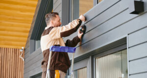 https://www.freepik.com/premium-photo/young-man-uniform-holding-alarm-system-while-standing-ladder_17095316.htm#fromView=search&page=1&position=10&uuid=f3d993b5-1b8a-4dda-bba1-ac597d463410&query=exterior+home+repair
