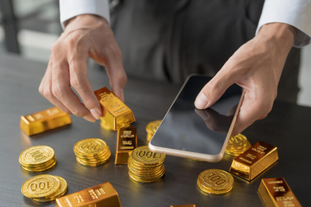 https://www.freepik.com/premium-photo/gold-trading-business-man-hand-offering-gold-investment-gold-mining-company-trading-gold-stock-exchange-rising-gold-prices_392116905.htm#fromView=search&page=1&position=31&uuid=aa472210-f015-4e30-b711-f8daae9229d8&query=gold+investing