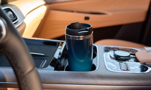 59106 https://www.freepik.com/premium-photo/gently-hand-placing-travel-mug-cars-cup-holder-convenience-comfort_380475501.htm#fromView=search&page=1&position=38&uuid=ceddce3a-56ca-4b72-809f-1b0627b7bbbf&query=car+cup+holder