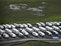 Trailers sit parked outside migrant detention center (AP Photo/Rebecca Blackwell/FILE)