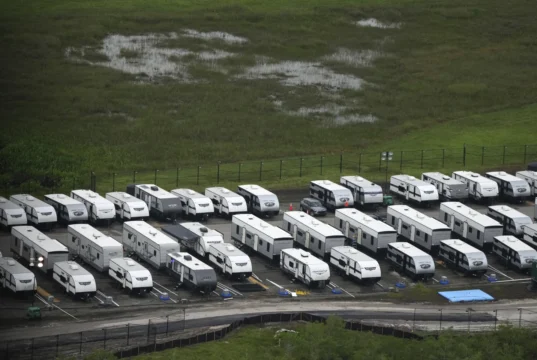 Trailers sit parked outside migrant detention center (AP Photo/Rebecca Blackwell/FILE)