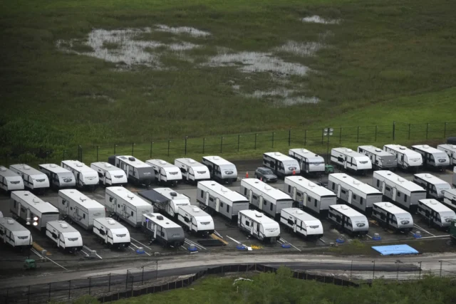 Trailers sit parked outside migrant detention center (AP Photo/Rebecca Blackwell/FILE)