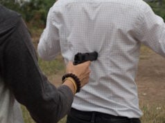 https://www.freepik.com/premium-photo/midsection-thief-aiming-gun-back-man_102197640.htm#fromView=search&page=1&position=20&uuid=e54986ef-fe66-421a-8373-93c03b057ffa&query=holding+someone+at+gunpoint