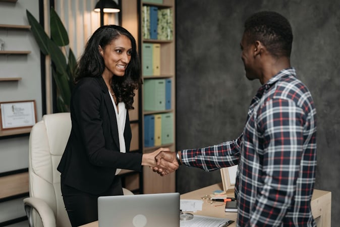 https://www.pexels.com/photo/female-lawyer-and-client-doing-a-handshake-8111895/