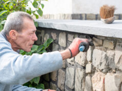 https://www.vecteezy.com/photo/65976083-a-builder-carefully-applies-cement-between-the-stones-of-a-wall-with-a-narrow-trowel-restoring-the-appearance-of-a-historic-building-using-professional-methods-and-tools