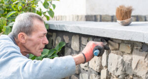 https://www.vecteezy.com/photo/65976083-a-builder-carefully-applies-cement-between-the-stones-of-a-wall-with-a-narrow-trowel-restoring-the-appearance-of-a-historic-building-using-professional-methods-and-tools