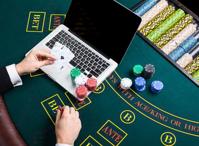 casino, online gambling, technology and people concept - close up of poker player with playing cards https://www.vecteezy.com/photo/35180523-casino-online-gambling-technology-and-people-concept-close-up-of-poker-player-with-playing-cards