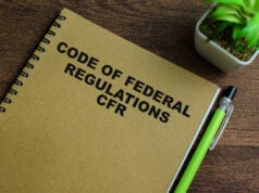 https://www.vecteezy.com/photo/39949787-concept-of-code-of-federal-regulations-cfr-write-on-book-isolated-on-wooden-table