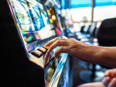 https://www.vecteezy.com/photo/24530011-gambler-pressing-slot-machine-button-in-the-casino