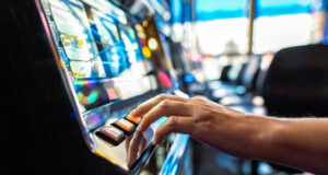 https://www.vecteezy.com/photo/24530011-gambler-pressing-slot-machine-button-in-the-casino