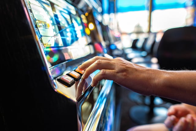 Gambler Pressing Slot Machine Button in the Casino https://www.vecteezy.com/photo/24530011-gambler-pressing-slot-machine-button-in-the-casino