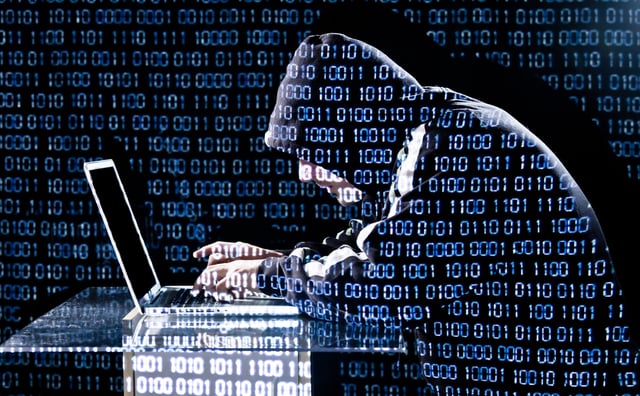 Hacker typing on a laptop https://www.vecteezy.com/photo/4304297-hacker-typing-on-a-laptop