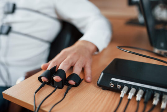 https://www.vecteezy.com/photo/15196997-hand-with-electrodes-on-fingers-is-on-the-table-suspicious-man-passes-lie-detector-in-the-office-asking-questions-polygraph-test