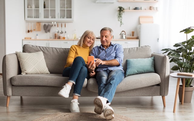 Happy Mature Husband And Wife Using Smartphone Sitting At Home https://www.vecteezy.com/photo/54447770-happy-mature-husband-and-wife-using-smartphone-with-new-application-browsing-internet-together-sitting-on-sofa-at-home-senior-people-texting-on-phone-mobile-app-communication-and-gadgets