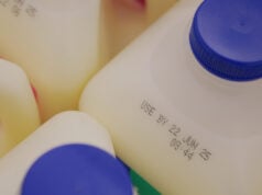 https://www.vecteezy.com/photo/68457833-milk-containers-showing-expiration-dates-in-grocery-setting