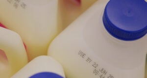 https://www.vecteezy.com/photo/68457833-milk-containers-showing-expiration-dates-in-grocery-setting