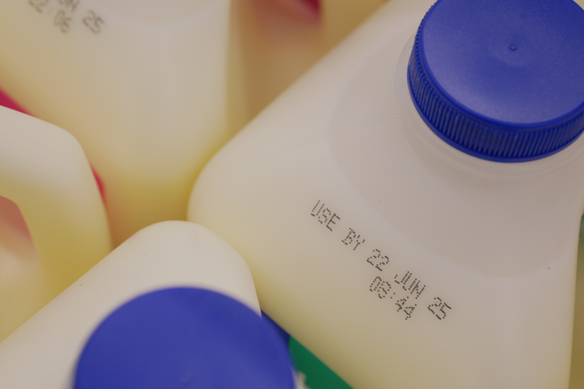 https://www.vecteezy.com/photo/68457833-milk-containers-showing-expiration-dates-in-grocery-setting